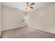 Cozy bedroom with carpet, fan, and natural light from the window at 2113 Dodson Woods Dr, Fairburn, GA 30213