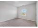 Simple bedroom with carpet and a bright window at 2113 Dodson Woods Dr, Fairburn, GA 30213