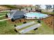 Aerial view of a community pool and recreation area including Bocce Ball courts at 400 Chaleur Way, Locust Grove, GA 30248