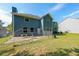 Expansive backyard with a well-maintained lawn and sturdy fencing, perfect for outdoor activities and privacy at 6220 Polar Fox Ct, Riverdale, GA 30296