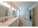 Bright bathroom features marble double vanity, soaking tub, and marble-tiled floors at 6220 Polar Fox Ct, Riverdale, GA 30296