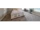 Large bedroom includes neutral carpeting, a double bed, and space for a home office at 6220 Polar Fox Ct, Riverdale, GA 30296