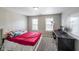 Bedroom featuring natural light, carpet floors and neutral walls at 6220 Polar Fox Ct, Riverdale, GA 30296