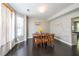 Formal dining room with bay window, hardwood floors, and ample natural light at 6220 Polar Fox Ct, Riverdale, GA 30296