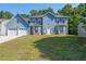 Charming two-story home featuring a two-car garage and beautiful blue siding at 6220 Polar Fox Ct, Riverdale, GA 30296