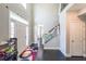 Bright, welcoming foyer with hardwood floors and staircase featuring decorative railing at 6220 Polar Fox Ct, Riverdale, GA 30296