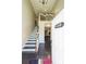 Bright, welcoming foyer with hardwood floors and staircase featuring decorative railing at 6220 Polar Fox Ct, Riverdale, GA 30296