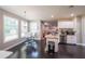 Open concept kitchen and dining area features modern fixtures and stainless dishwasher at 6220 Polar Fox Ct, Riverdale, GA 30296