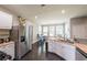 Spacious kitchen with stainless steel appliances and granite counters opens to dining area at 6220 Polar Fox Ct, Riverdale, GA 30296