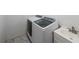 Laundry room featuring sink and tile floors at 6220 Polar Fox Ct, Riverdale, GA 30296