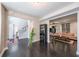 Open-concept living room with hardwood floors and seamless flow to other living spaces at 6220 Polar Fox Ct, Riverdale, GA 30296