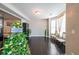Inviting living room area with hardwood floors and lots of natural light from windows at 6220 Polar Fox Ct, Riverdale, GA 30296