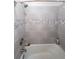 Tile shower with grey tones at 6220 Polar Fox Ct, Riverdale, GA 30296