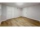 Finished basement with light hardwood flooring and a drop ceiling at 8007 Northcrest Dr, Jonesboro, GA 30238