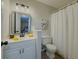 Modern bathroom with vanity, decorative mirror and white shower curtain at 8007 Northcrest Dr, Jonesboro, GA 30238