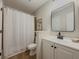 Bright bathroom featuring a modern vanity with a sleek countertop and a stylish mirror at 8007 Northcrest Dr, Jonesboro, GA 30238
