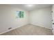 Bedroom featuring carpet flooring and a window providing natural light at 8007 Northcrest Dr, Jonesboro, GA 30238