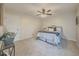 Cozy bedroom featuring plush carpeting, a ceiling fan, and neutral color scheme at 8007 Northcrest Dr, Jonesboro, GA 30238