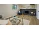 Comfortable living room with stone fireplace, new floors, and neutral paint colors at 8007 Northcrest Dr, Jonesboro, GA 30238