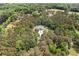 Beautiful wooded acreage with winding driveway leading to house at 1064 Highway 20 E, Mcdonough, GA 30252