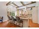 Bright kitchen with wooden beams, granite countertops, custom cabinets, and stainless appliances at 1064 Highway 20 E, Mcdonough, GA 30252