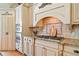 Kitchen with granite counters, stainless appliances, range hood and decorative tile backsplash at 1064 Highway 20 E, Mcdonough, GA 30252