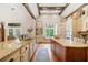 Spacious kitchen with granite countertops, island and breakfast nook and exposed beam vaulted ceiling at 1064 Highway 20 E, Mcdonough, GA 30252