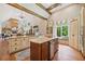 Open kitchen with breakfast nook, island, stainless appliances and view into living area at 1064 Highway 20 E, Mcdonough, GA 30252