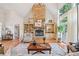 Elegant living room featuring a stone fireplace and lots of natural light at 1064 Highway 20 E, Mcdonough, GA 30252