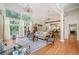 Bright living room with large windows, hardwood floors, high ceilings, and elegant furnishings at 1064 Highway 20 E, Mcdonough, GA 30252