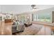 Open-concept living area featuring hardwood floors, modern decor, and ample natural light at 1064 Highway 20 E, Mcdonough, GA 30252