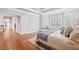 Large main bedroom with hardwood floors, tray ceiling, large windows and window seat at 1064 Highway 20 E, Mcdonough, GA 30252
