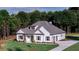 Well-manicured lawn surrounds a modern farmhouse-style home with an attached two-car garage at 140 Paislee Park (Lot #5 Paislee Park) Dr, Fayetteville, GA 30215