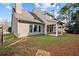 Well-maintained backyard with a covered patio, ideal for outdoor entertainment at 1481 Wild Rye Ln, Grayson, GA 30017