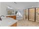 Spacious bathroom featuring dual vanities, soaking tub, tiled shower, and picture window at 1481 Wild Rye Ln, Grayson, GA 30017