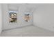 Bedroom featuring carpet flooring and windows with outside views at 1481 Wild Rye Ln, Grayson, GA 30017