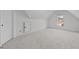 Spacious bonus room with plush carpeting, natural light, and neutral paint at 1481 Wild Rye Ln, Grayson, GA 30017