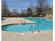 Community pool features an in-pool lounge, ideal for relaxing in the sun at 1481 Wild Rye Ln, Grayson, GA 30017