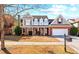 Charming two-story home with a well-manicured lawn and inviting front porch at 1481 Wild Rye Ln, Grayson, GA 30017