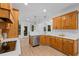 Spacious kitchen featuring stainless steel appliances and modern countertops at 1481 Wild Rye Ln, Grayson, GA 30017