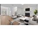 Comfortable living room with fireplace, large windows, and neutral décor at 1481 Wild Rye Ln, Grayson, GA 30017