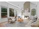 Bright living room features large windows, fireplace, built-ins, and neutral tones at 1481 Wild Rye Ln, Grayson, GA 30017