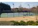 Well-maintained community tennis courts surrounded by mature trees and landscaping at 1481 Wild Rye Ln, Grayson, GA 30017