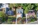 Aerial view of the property showing the house, driveway, and surrounding greenery and neighborhood at 3267 Sewell Mill Rd, Marietta, GA 30062