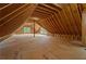 Unfinished attic space with exposed beams, offering potential for conversion into a living area at 3267 Sewell Mill Rd, Marietta, GA 30062