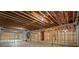 Unfinished basement with exposed wood beams and ductwork offering a blank canvas for customization at 3267 Sewell Mill Rd, Marietta, GA 30062