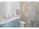 Stylish powder room features modern fixtures, a chic vanity, and beautiful marble accent wall at 3267 Sewell Mill Rd, Marietta, GA 30062