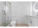 Elegant bathroom featuring a glass shower door, and a modern vanity with gold fixtures at 3267 Sewell Mill Rd, Marietta, GA 30062