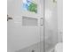 Modern bathroom featuring a tiled shower with glass door, and a tiled niche at 3267 Sewell Mill Rd, Marietta, GA 30062