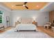 Bright main bedroom with a wood ceiling, plush bedding, and natural light, creating a relaxing retreat at 3267 Sewell Mill Rd, Marietta, GA 30062